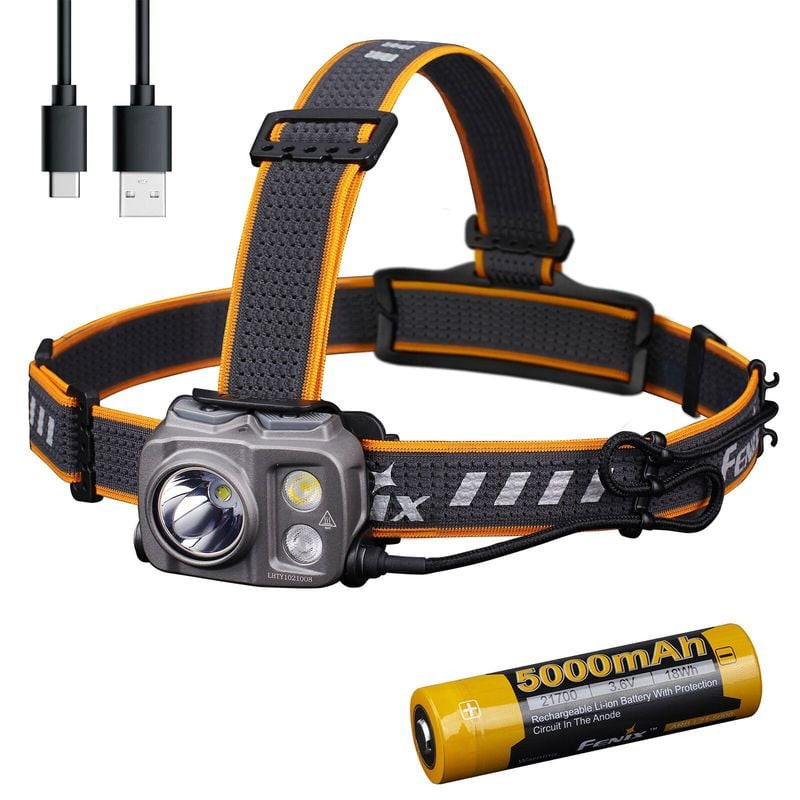 Lampe frontale Fenix HP25R V2.0 sur un rocher montrant trois modes d'éclairage : spot, large, rouge.
