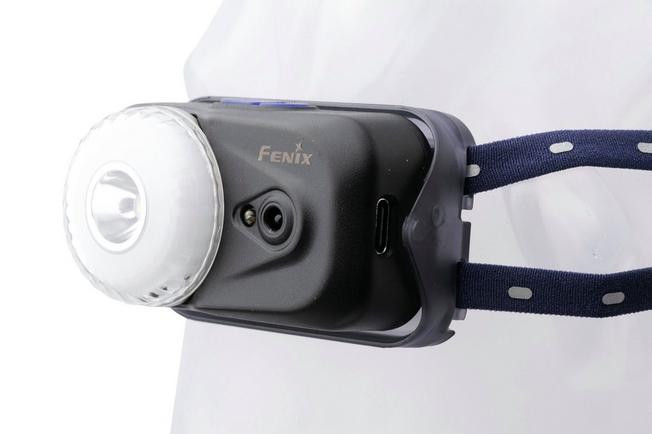 1418403 Fenix HL17R used as right-angle flashlight with magnetic base on metal surface.