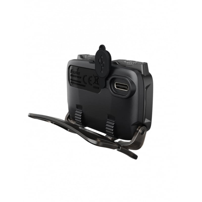 Gros plan sur la lampe frontale Fenix HL12R V2.0 montrant le port de charge USB-C et le bouton du mo