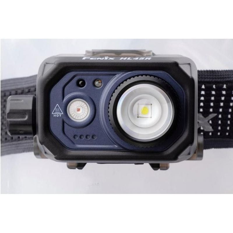 Détail du bouton de contrôle et du capteur gestuel de la Fenix HL45R, montrant l'interface mains lib