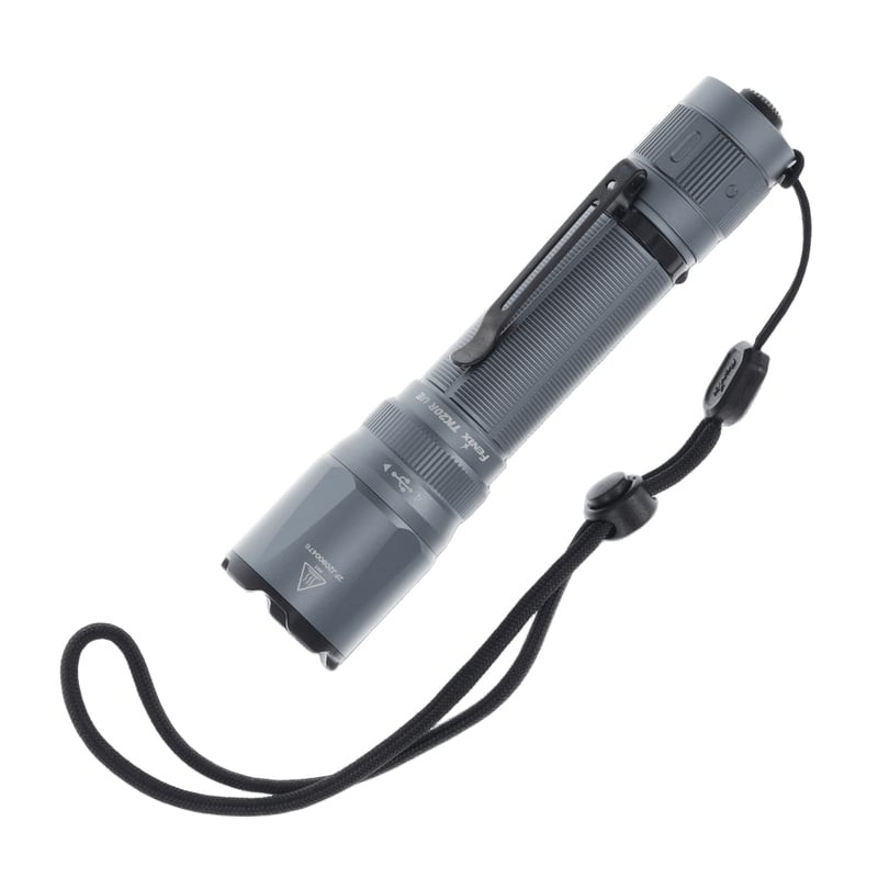 Lampe de poche tactique Fenix TK20R UE vue de face montrant la lentille et la bague de choc en acier