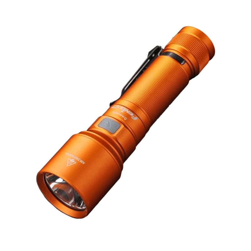 Lampe torche LED rechargeable orange édition limitée Fenix C7 avec base magnétique sur fond sombre.